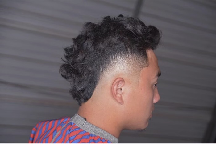 Curly textured cut with taper
